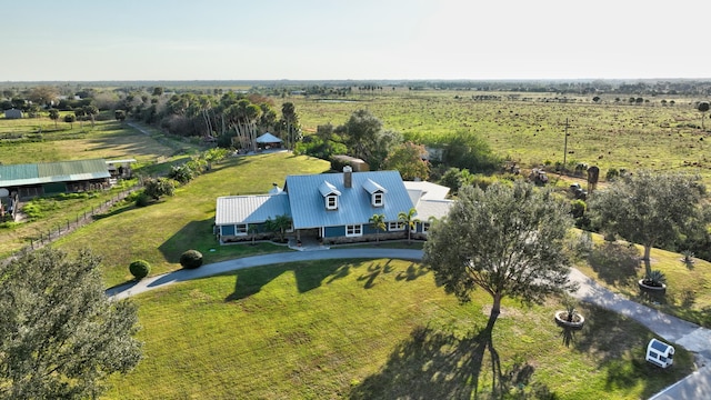 birds eye view of property with a rural view