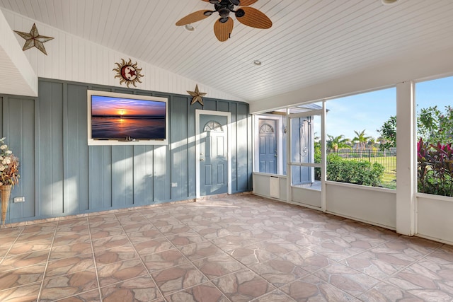 unfurnished sunroom featuring vaulted ceiling, wooden ceiling, and ceiling fan