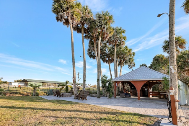 surrounding community featuring a gazebo, a yard, and a patio area