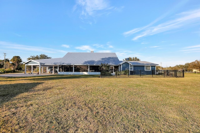 back of property featuring a yard