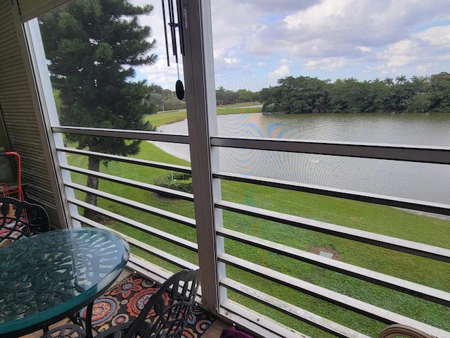 balcony featuring a water view