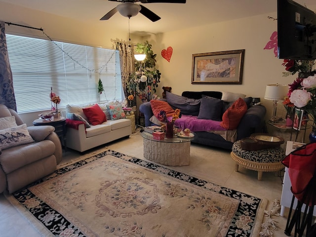 living room featuring light tile patterned floors and ceiling fan