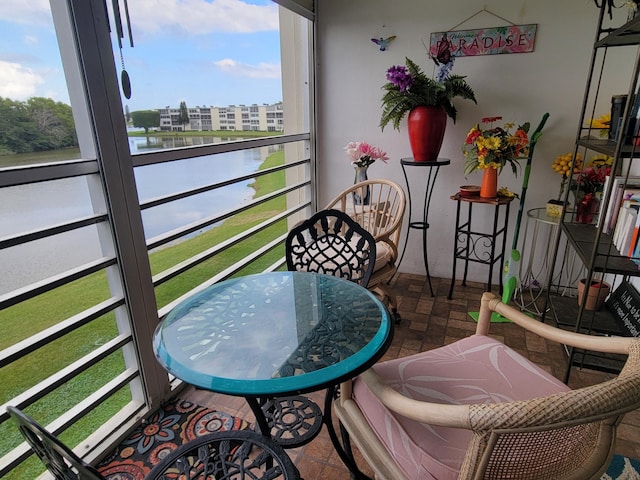 balcony featuring a water view