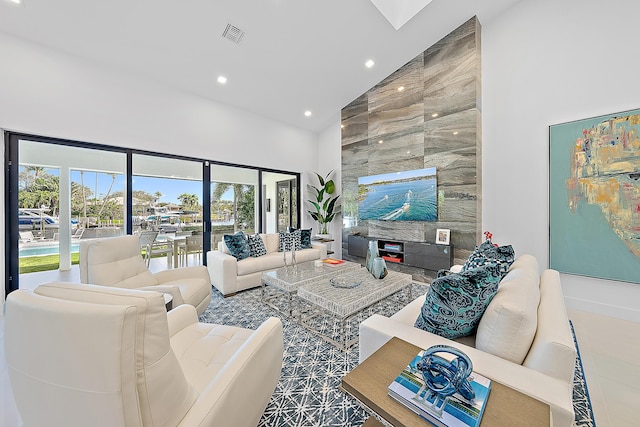 living room featuring high vaulted ceiling