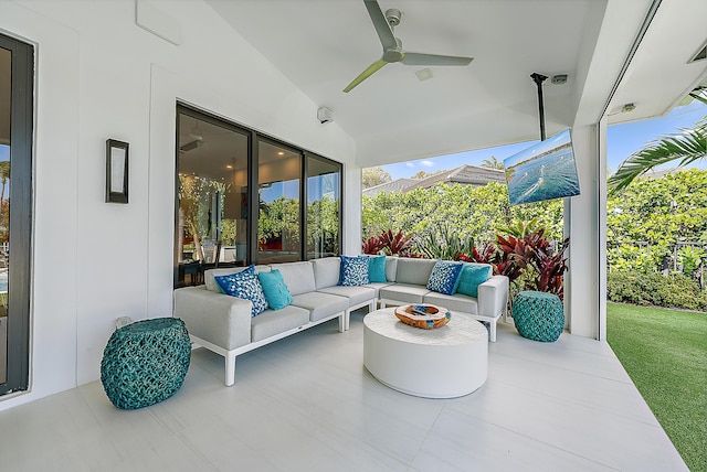 view of patio with ceiling fan and an outdoor living space