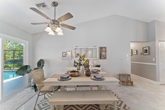 dining room with lofted ceiling