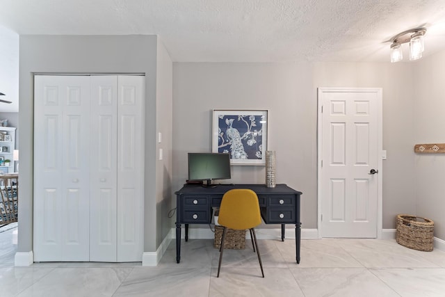 office space featuring a textured ceiling