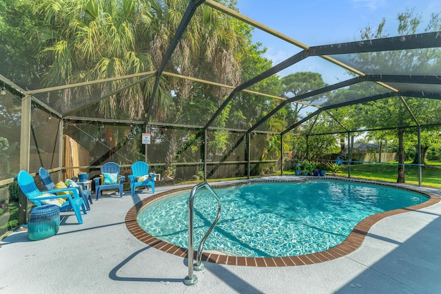 view of swimming pool featuring a lanai and a patio area