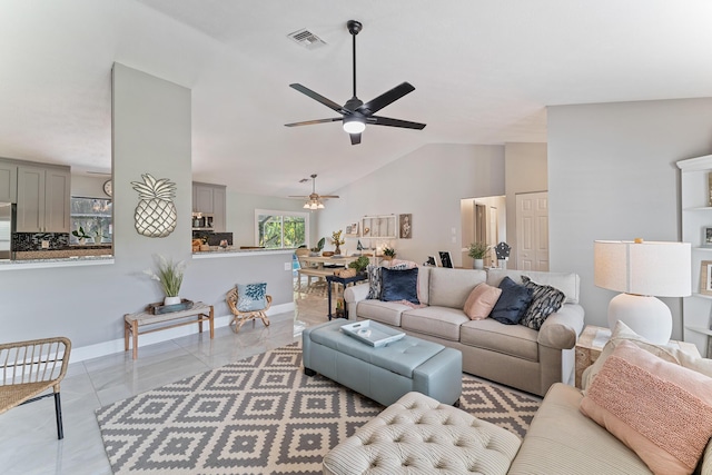 living room with vaulted ceiling and ceiling fan