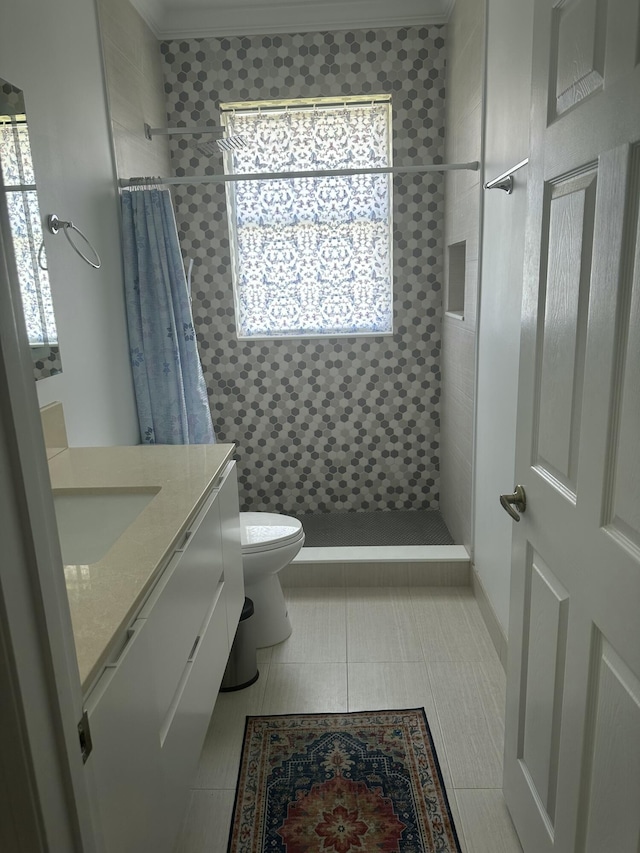 bathroom featuring walk in shower, tile patterned floors, vanity, and toilet