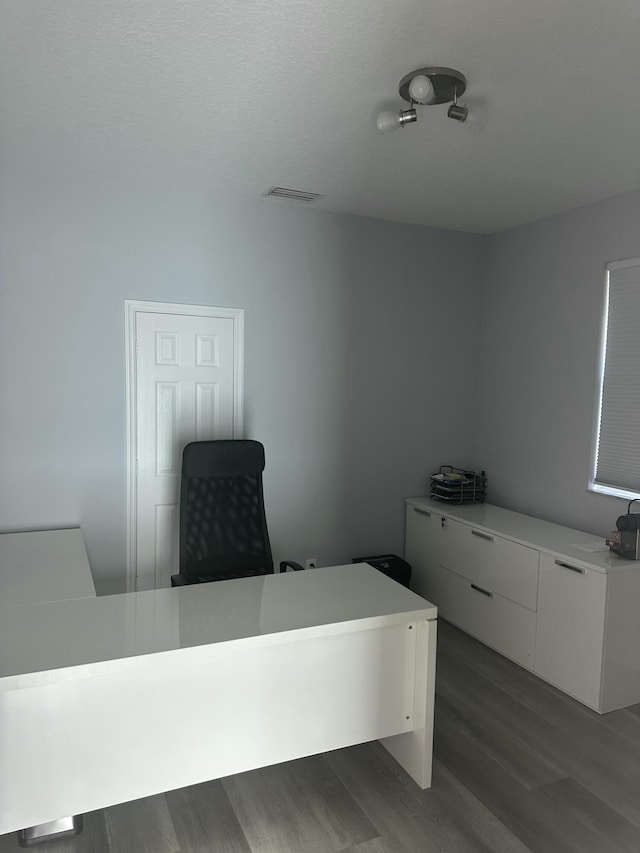 office with dark wood-type flooring