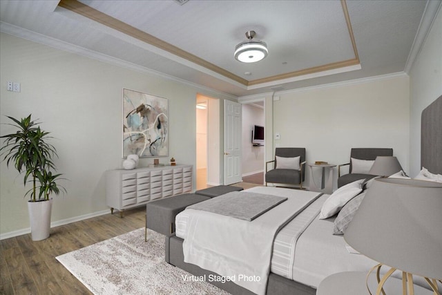 bedroom with ornamental molding, wood finished floors, a raised ceiling, and baseboards