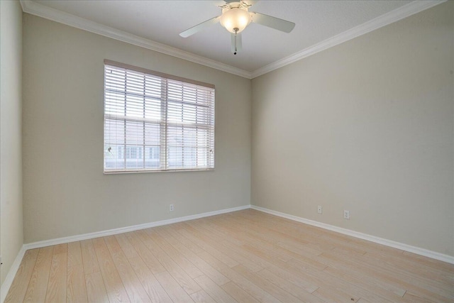 empty room featuring ceiling fan, crown molding, baseboards, and wood finished floors