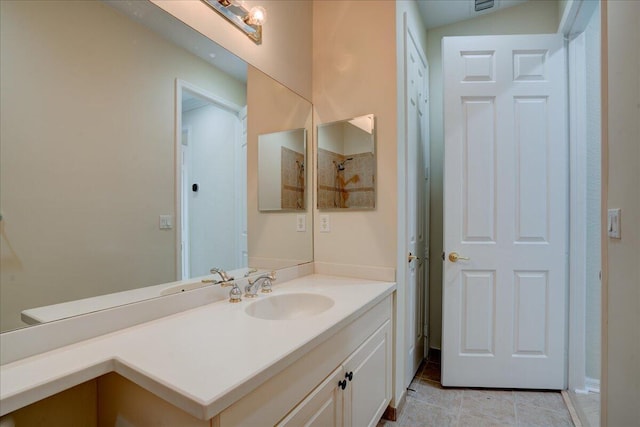 bathroom with vanity and tile patterned floors