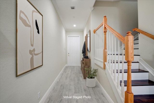 corridor with visible vents, baseboards, ornamental molding, wood finished floors, and recessed lighting