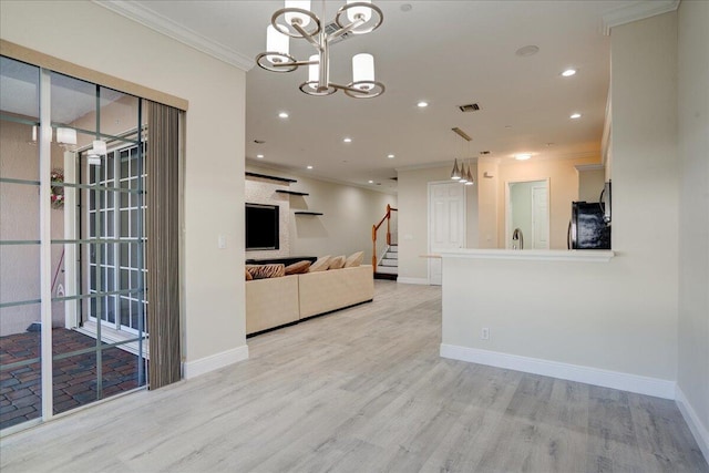 unfurnished living room with visible vents, ornamental molding, light wood-type flooring, baseboards, and stairs