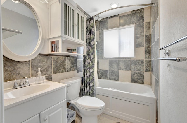 bathroom featuring toilet, shower / bath combo, tile walls, and vanity