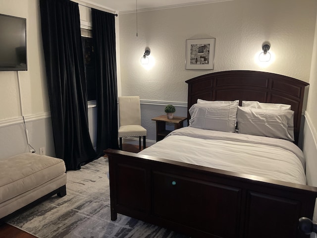 bedroom featuring a textured wall