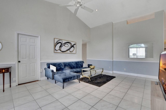 living area featuring high vaulted ceiling, baseboards, and tile patterned floors