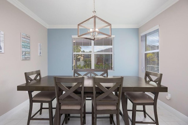 dining room with ornamental molding and a chandelier