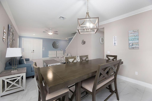 dining area with crown molding and ceiling fan with notable chandelier