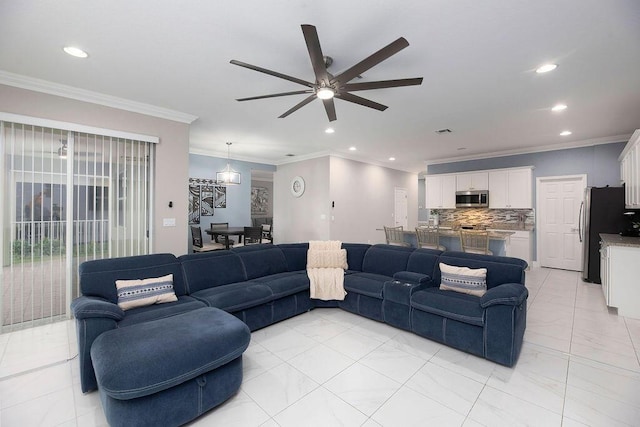 living room featuring crown molding and ceiling fan