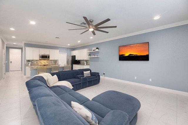 living room featuring crown molding and ceiling fan