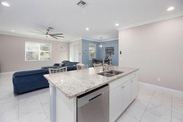 kitchen featuring sink, stainless steel dishwasher, ornamental molding, an island with sink, and white cabinets