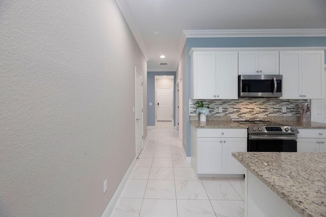 kitchen featuring light stone counters, crown molding, appliances with stainless steel finishes, decorative backsplash, and white cabinets