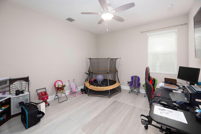 bedroom featuring light hardwood / wood-style flooring and ceiling fan