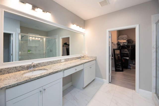 bathroom with vanity and an enclosed shower