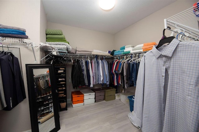 spacious closet featuring light hardwood / wood-style flooring