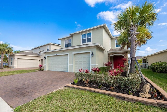 view of front of house featuring a garage and a front yard