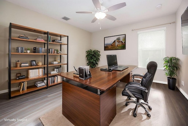 office space with dark wood-type flooring and ceiling fan