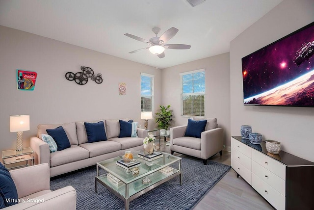 living room with hardwood / wood-style floors and ceiling fan