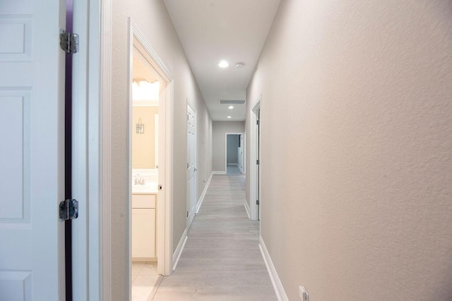 hallway featuring light hardwood / wood-style floors