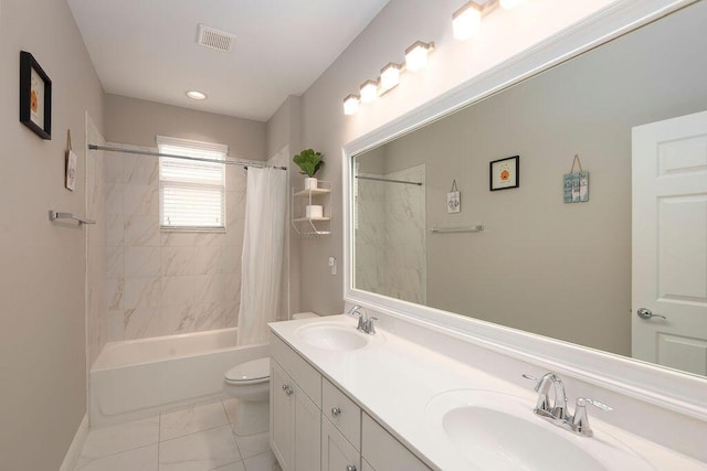 full bathroom with vanity, toilet, and shower / bath combo