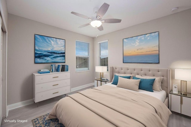 bedroom with hardwood / wood-style flooring and ceiling fan