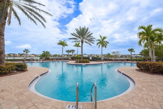 view of swimming pool with a patio area