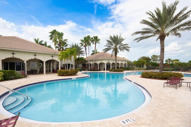 view of swimming pool featuring a patio