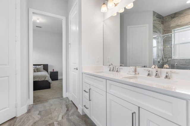 bathroom featuring vanity and a shower with door