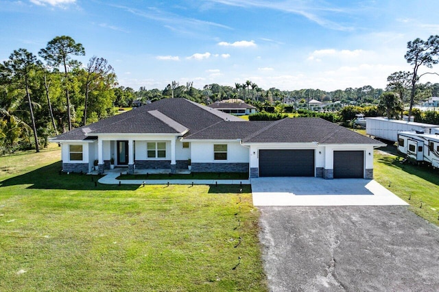 view of front facade featuring a garage and a front yard