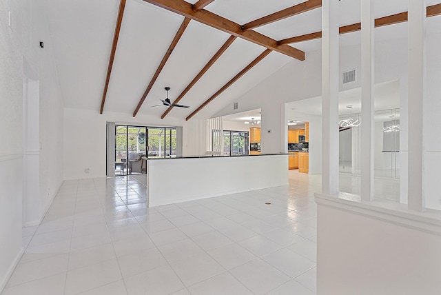 empty room featuring light tile patterned floors, high vaulted ceiling, ceiling fan, visible vents, and beamed ceiling