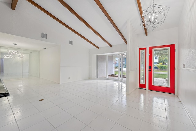 foyer entrance with an inviting chandelier, visible vents, and tile patterned floors