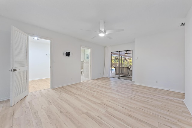 unfurnished room with light wood finished floors, baseboards, and a ceiling fan