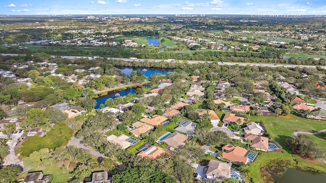 birds eye view of property with a water view and a residential view