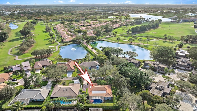 birds eye view of property with a water view, a residential view, and golf course view