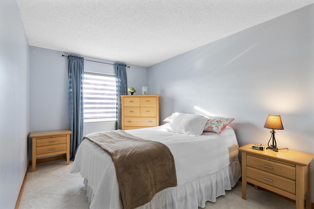 bedroom featuring a textured ceiling