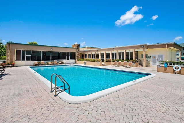 view of swimming pool featuring a patio