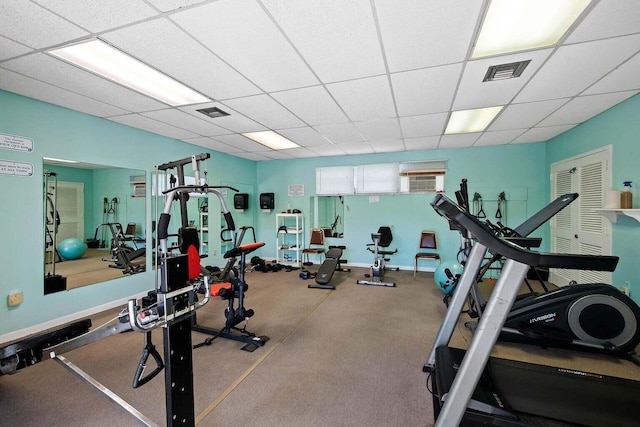 workout area with a drop ceiling